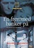 Movies En fremmed banker pa poster